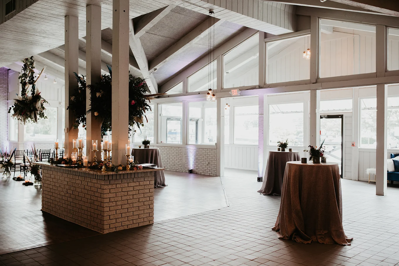 A boho-styled wedding setup with florals and warm lighting at The Little Cottage