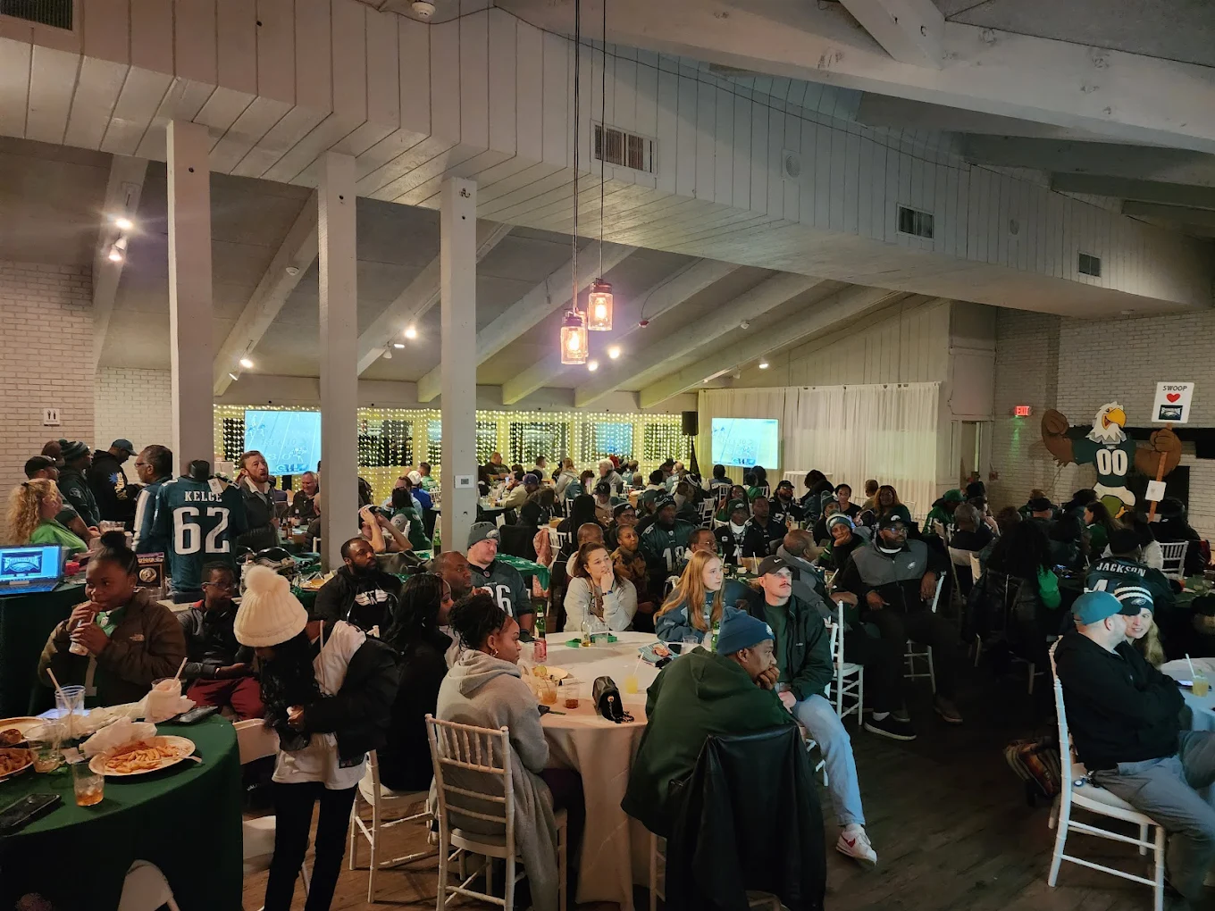 Guests gathered for a meet-up event in the main room at The Little Cottage